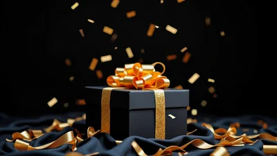 Black Gift Box With Gold Ribbon And Confetti