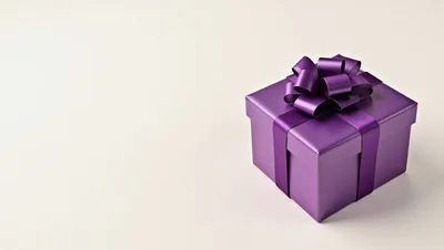 Purple Gift Box With Ribbon On White Background