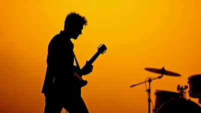 Silhouette Of A Guitarist Performing On Stage