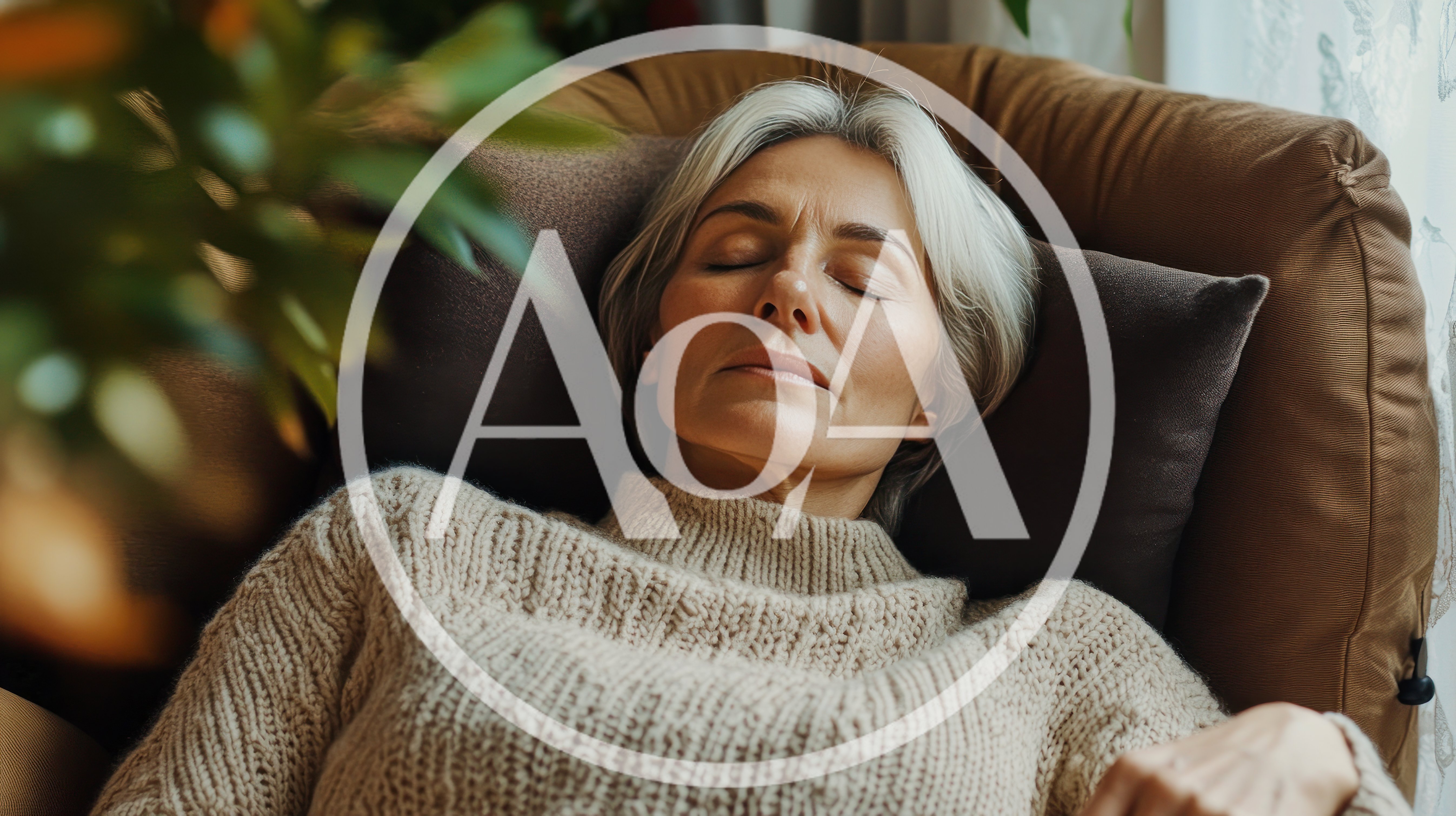 Mature Woman Resting With Eyes Closed In Armchair