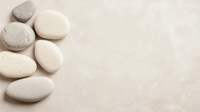 Smooth White and Grey Stones on Textured Background