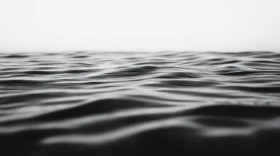 Calm Dark Ocean Waves At Horizon