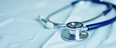 Medical Stethoscope Resting On A White Lab Coat