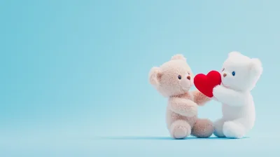 Two Cute Teddy Bears Holding A Red Heart
