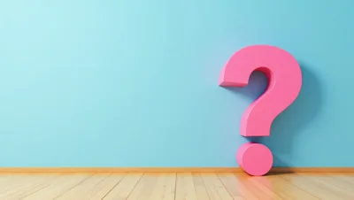 Large Pink Question Mark Against Blue Wall