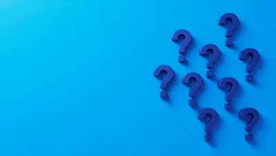 Blue Question Marks Floating On Blue Background