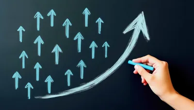 Hand Drawing Upward Growth Arrows On Chalkboard