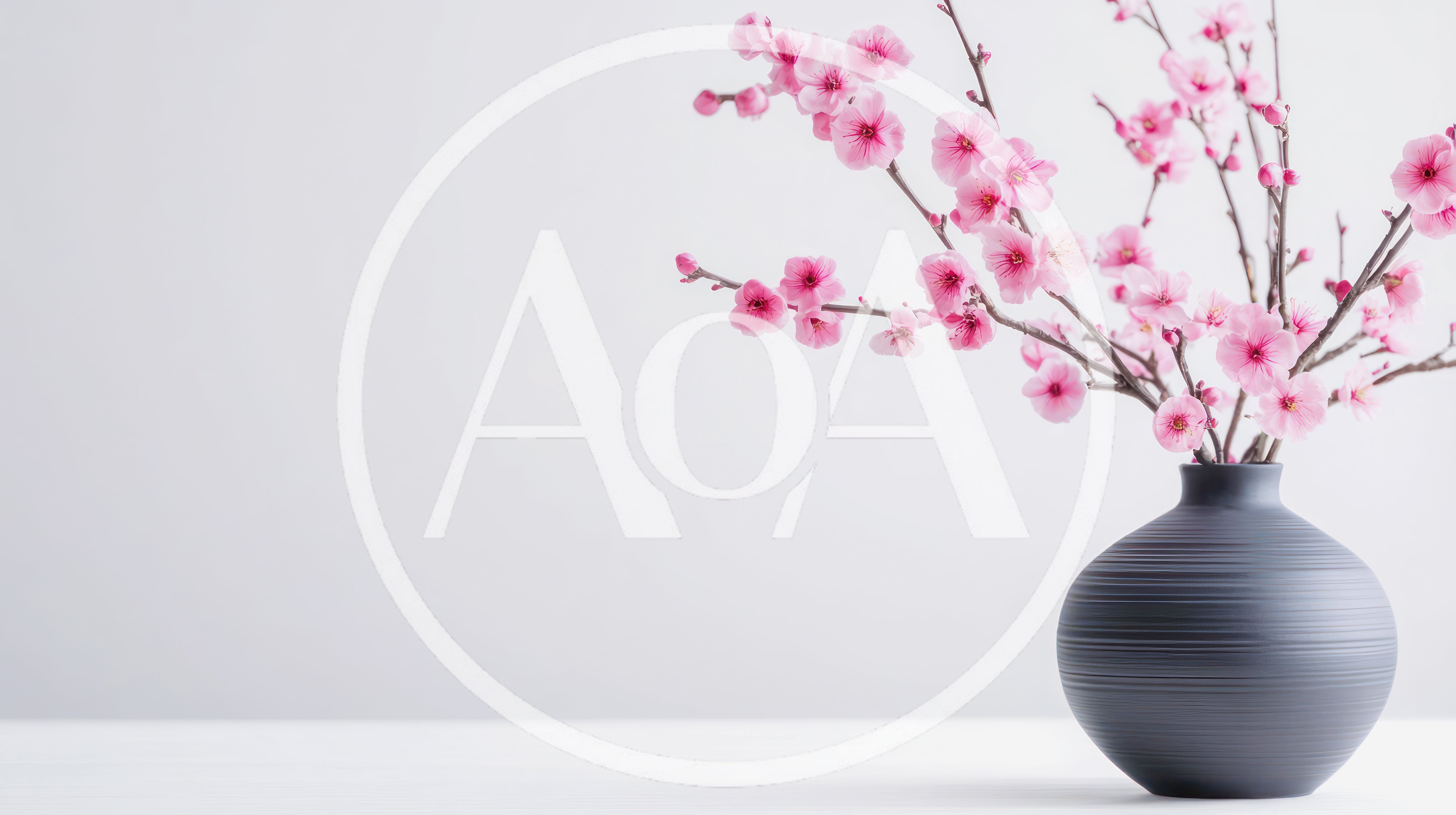 Pink Cherry Blossom Branches in a Dark Vase
