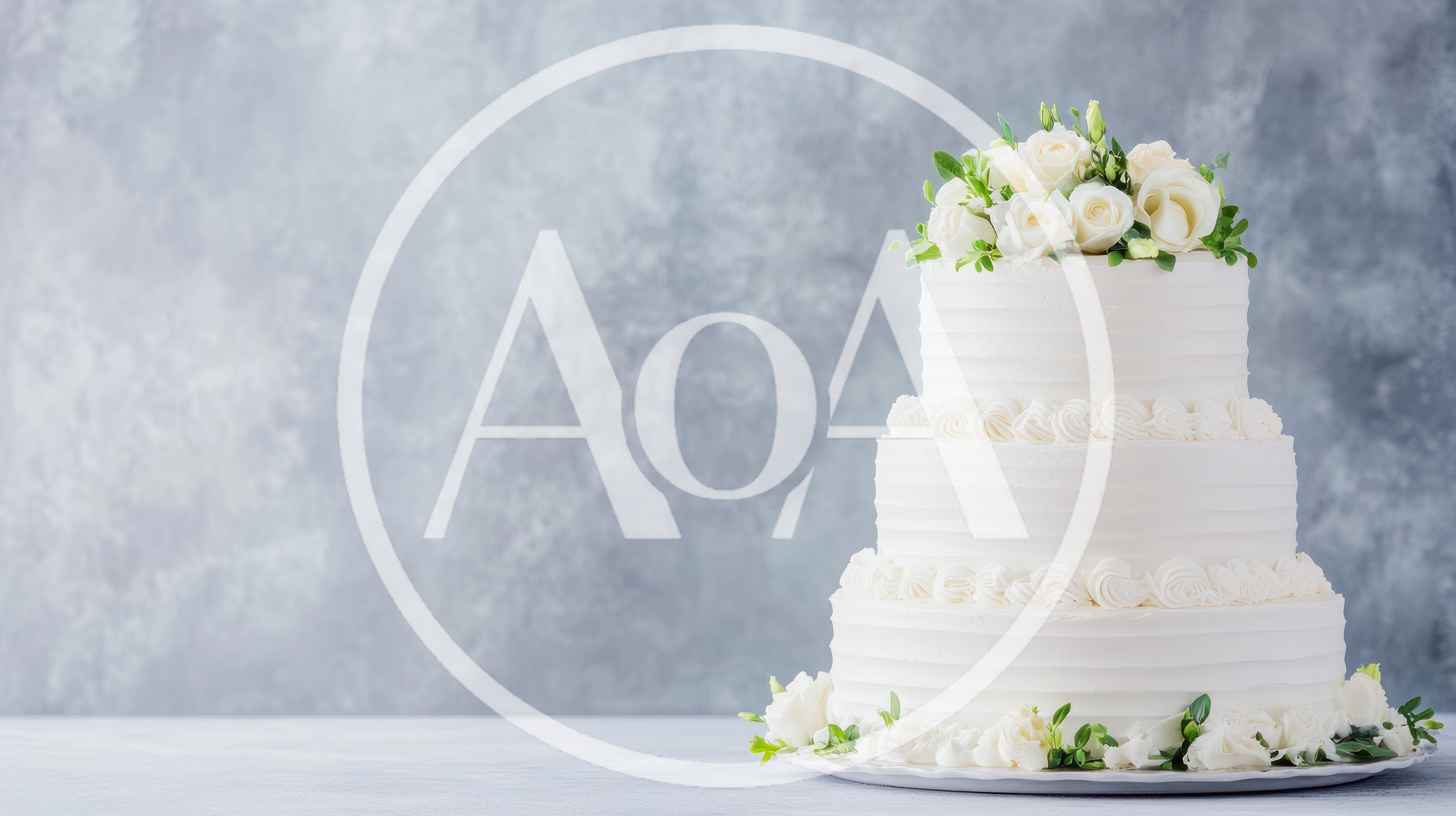 Three Tiered White Wedding Cake With Floral Topper
