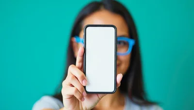 Woman Holding Smartphone With Blank Screen