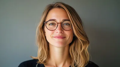 Portrait Of A Smiling Woman Wearing Glasses