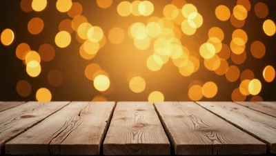 Empty Wooden Table Against Golden Bokeh Background