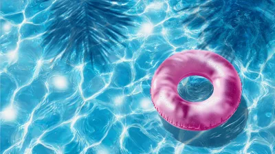 Pink Inflatable Pool Ring Floating On Water