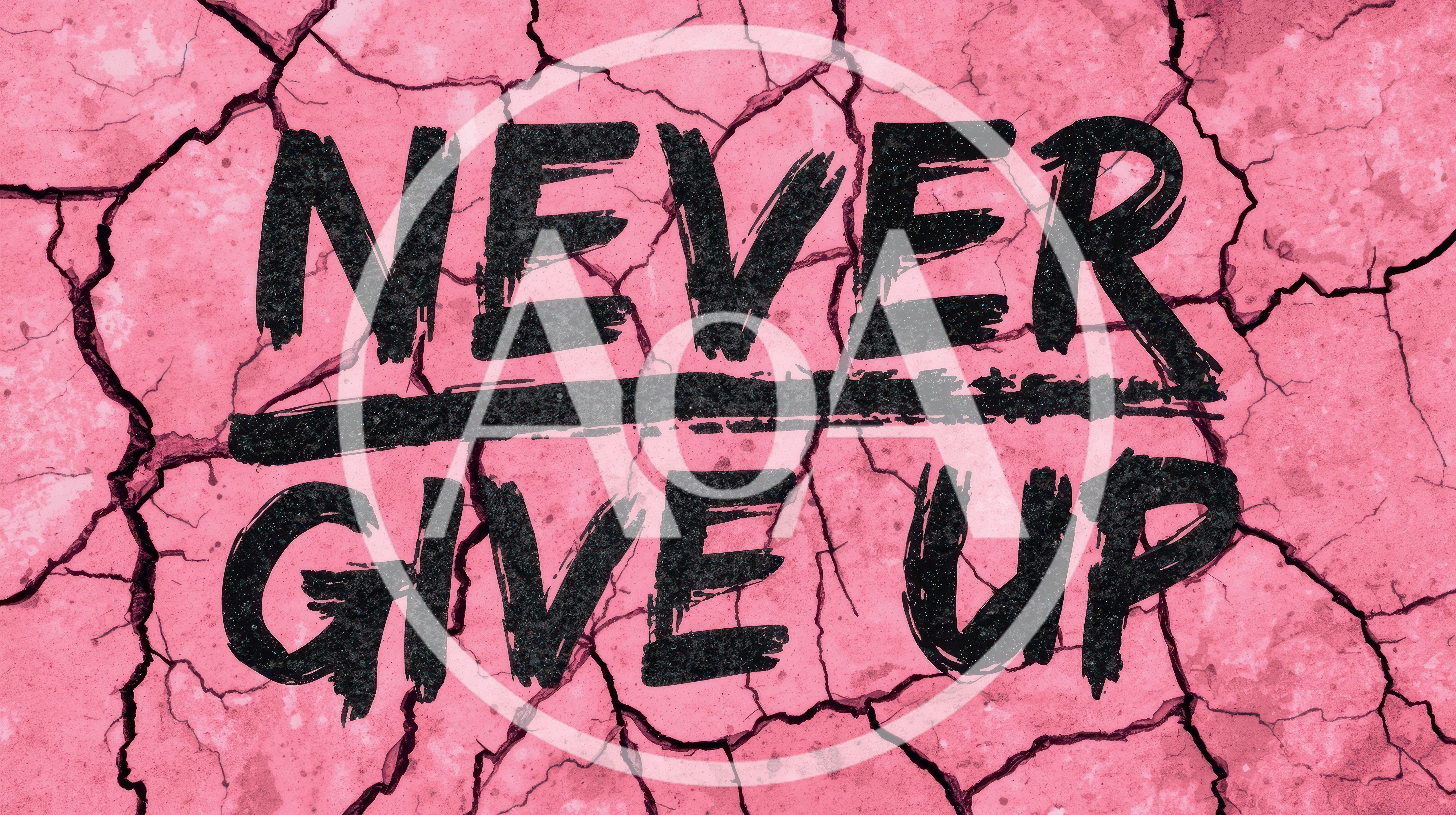 Never Give Up Text On Cracked Pink Ground