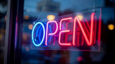 Neon Open Sign Glowing In A Store Window