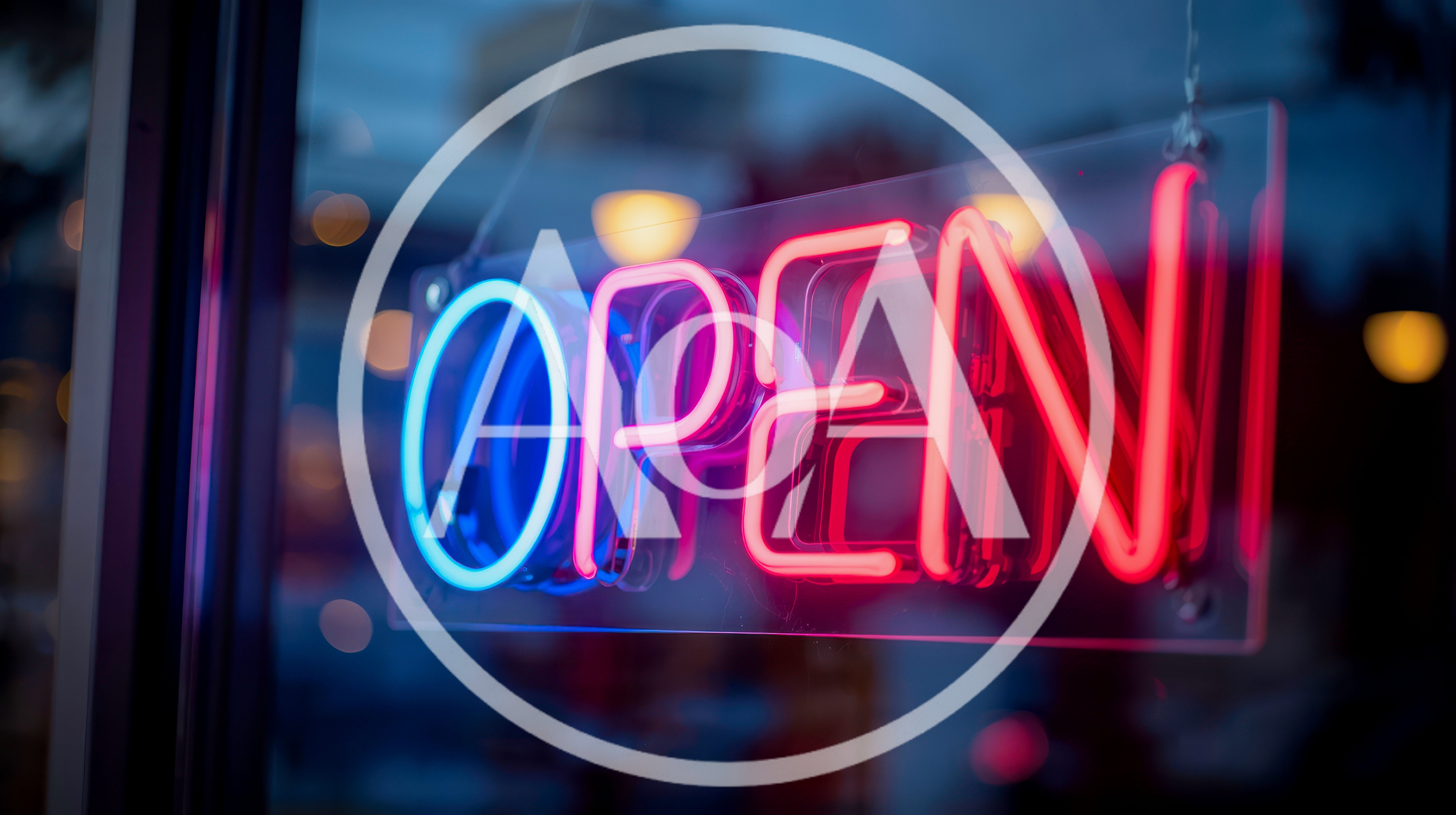 Neon Open Sign Glowing In A Store Window