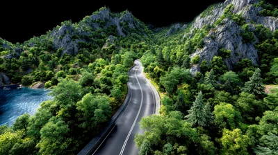 Aerial View Of A Winding Mountain Road