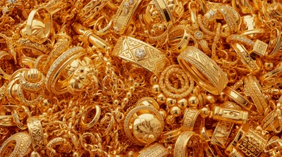 Pile Of Luxurious Gold Jewelry And Ornate Rings