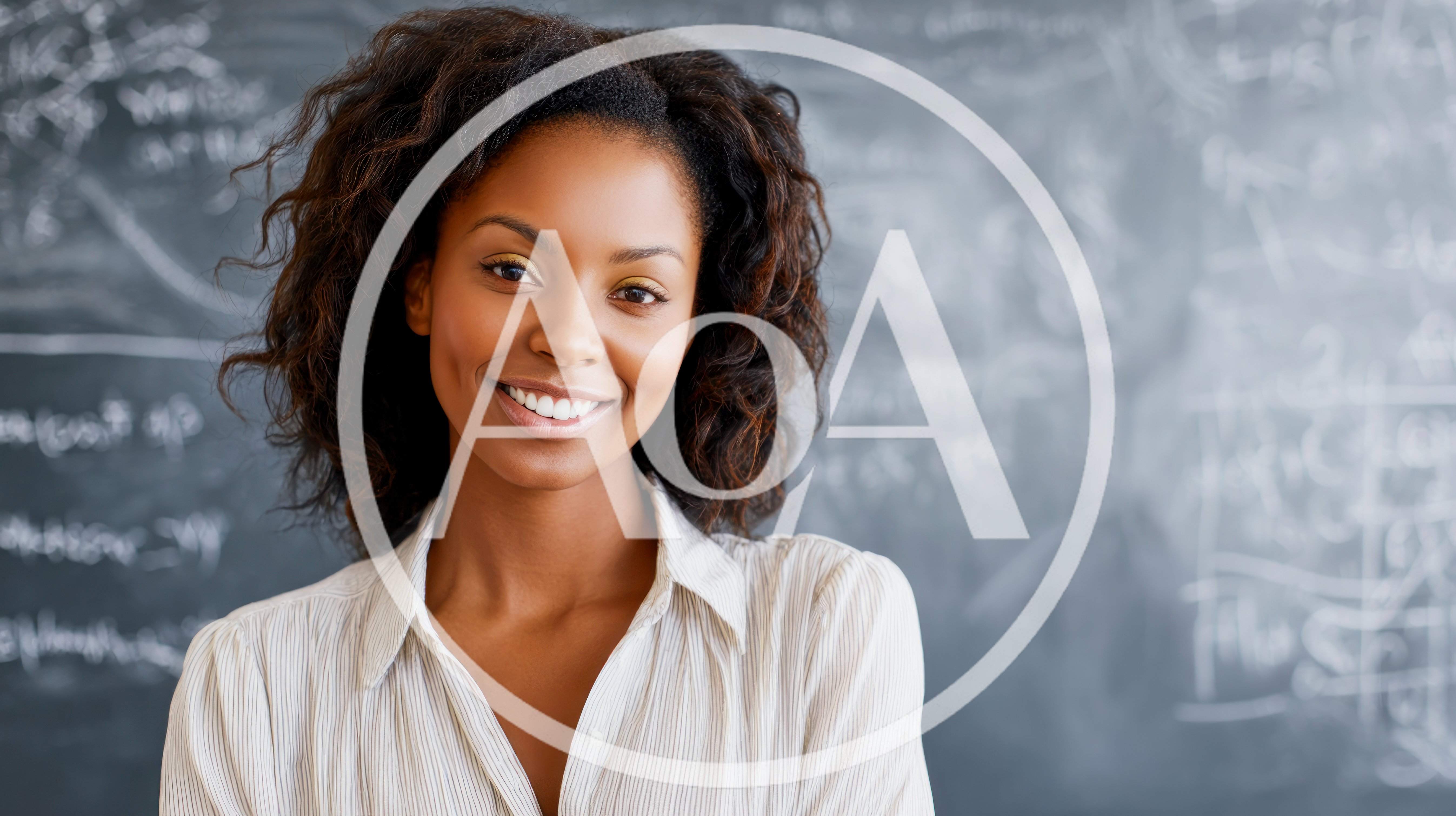 Smiling African American Female Teacher Standing In Classroom