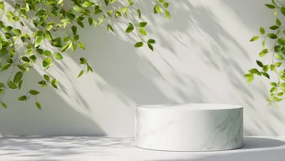 Marble Pedestal Display With Green Foliage
