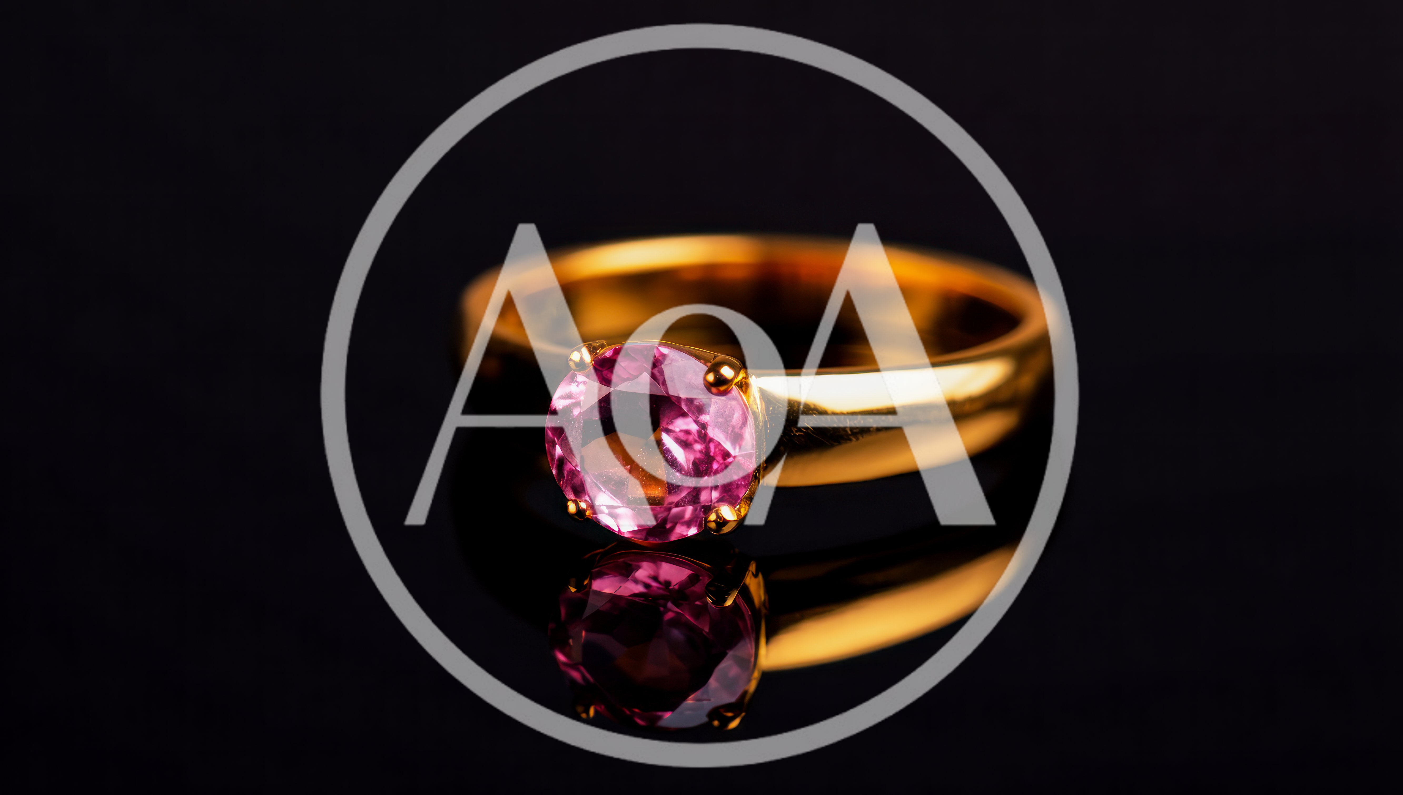 Gold Ring With Pink Gemstone On Black Background