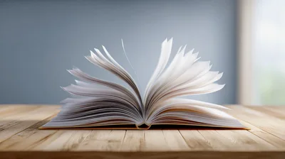 Open Book With Flipping Pages On Wooden Table