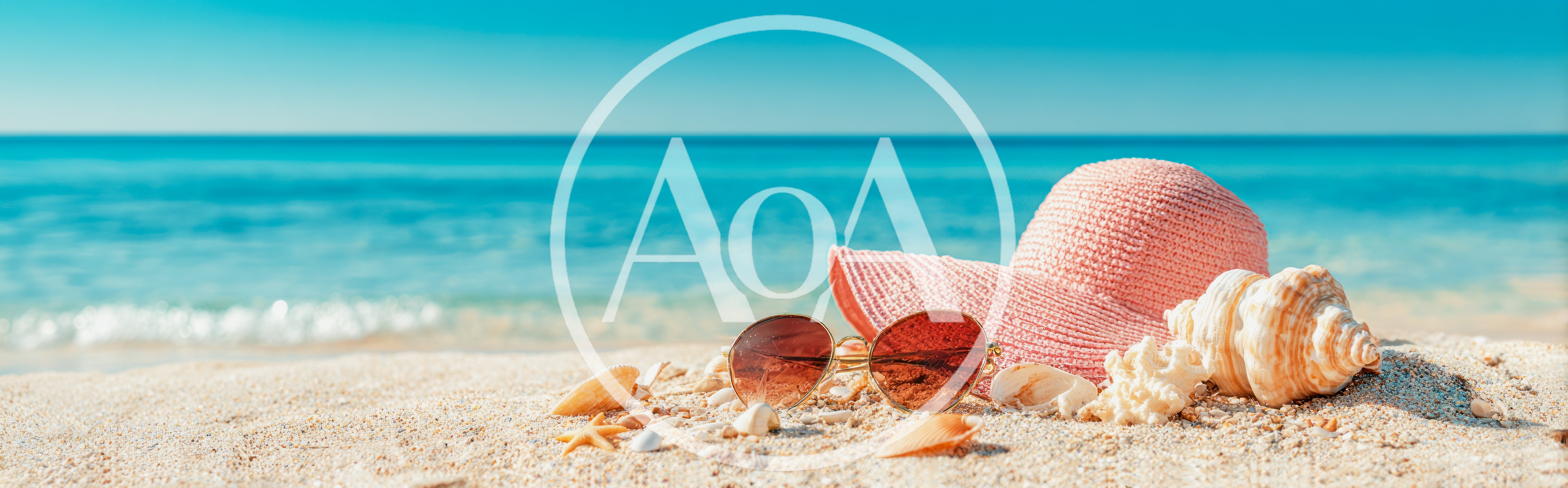 Pink Sun Hat and Sunglasses on Sandy Beach