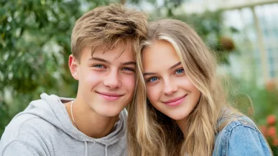 Portrait Of A Smiling Teenage Couple Outdoors