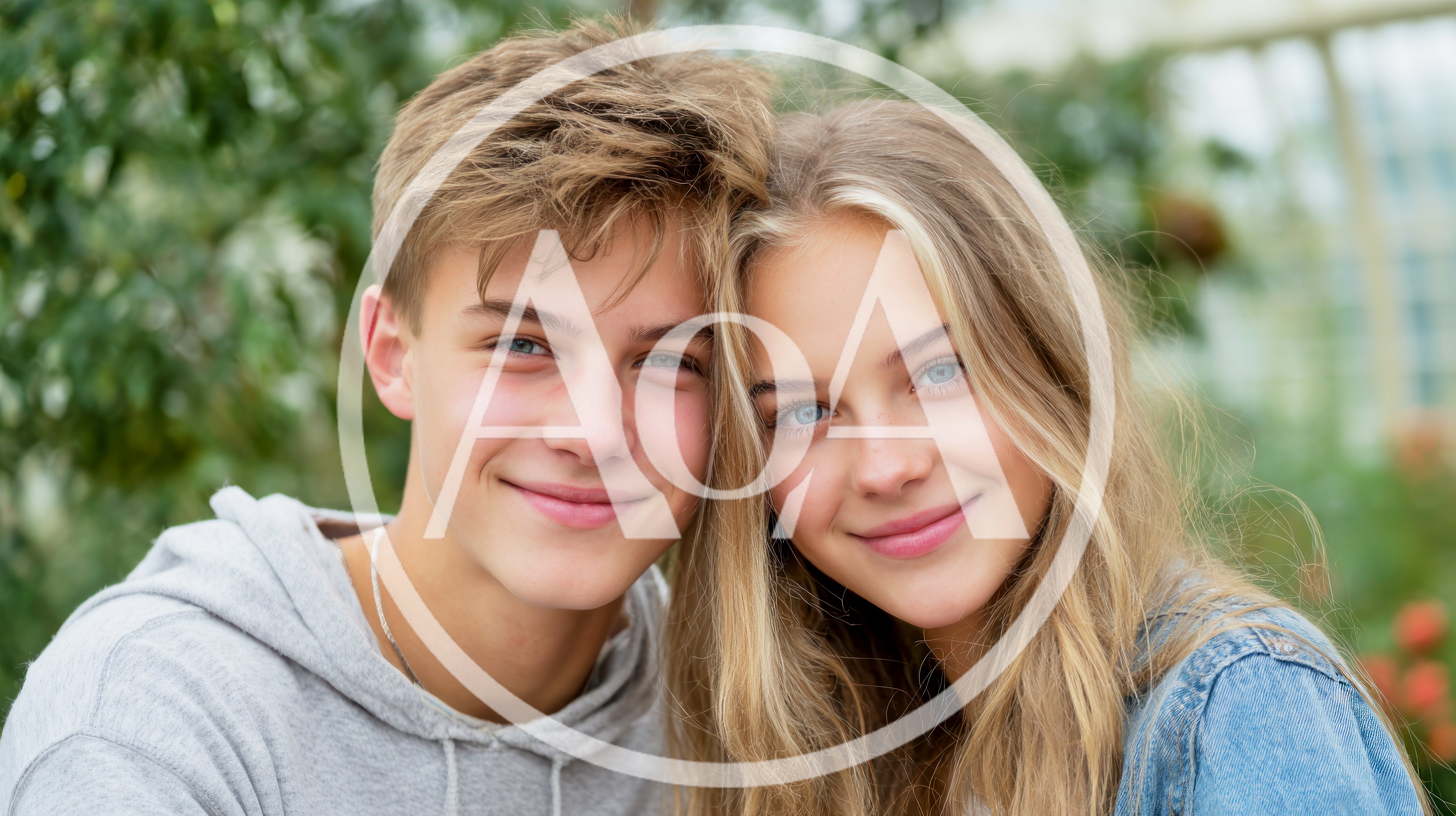 Portrait Of A Smiling Teenage Couple Outdoors