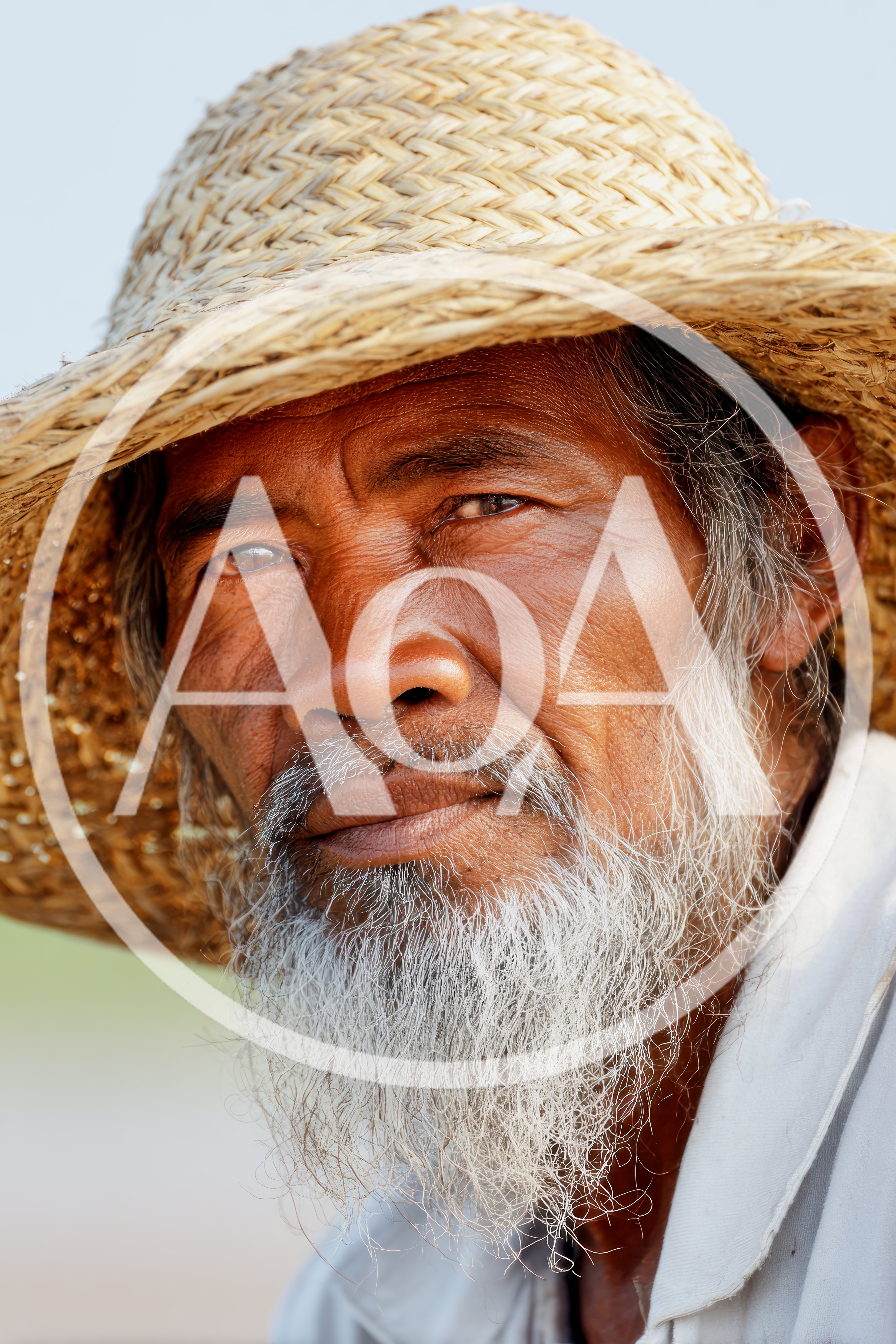 Portrait Of An Elderly Asian Farmer Wearing Straw Hat