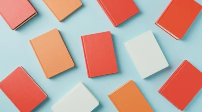 Flat Lay Of Colorful Hardcover Books On Blue Background