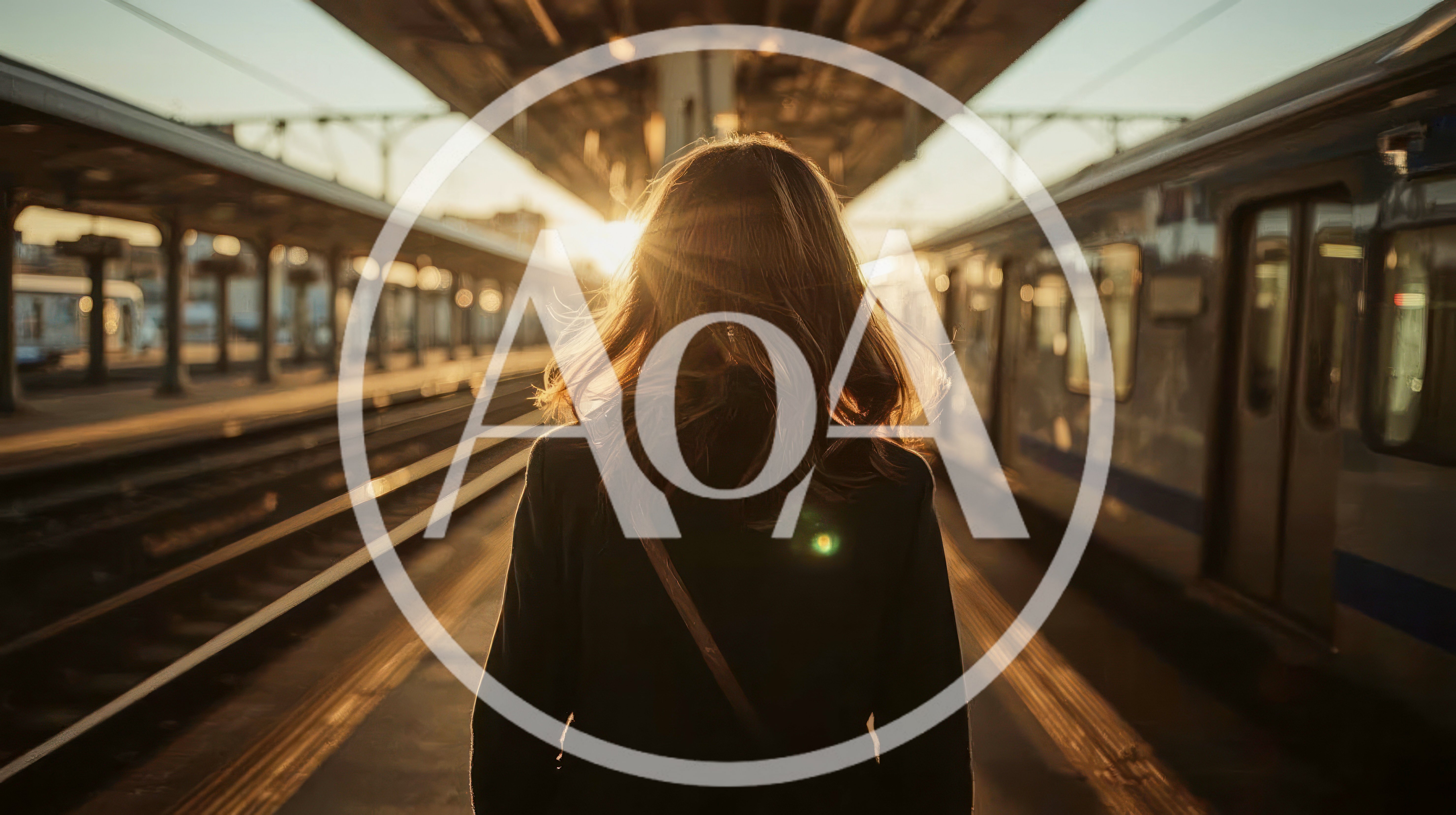 Woman Standing On Train Platform At Sunset