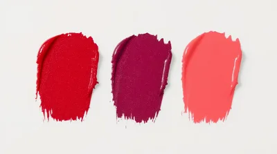 Three Vibrant Lipstick Swatches On White Background