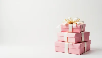 Stack of Three Pink Gift Boxes with Ribbon