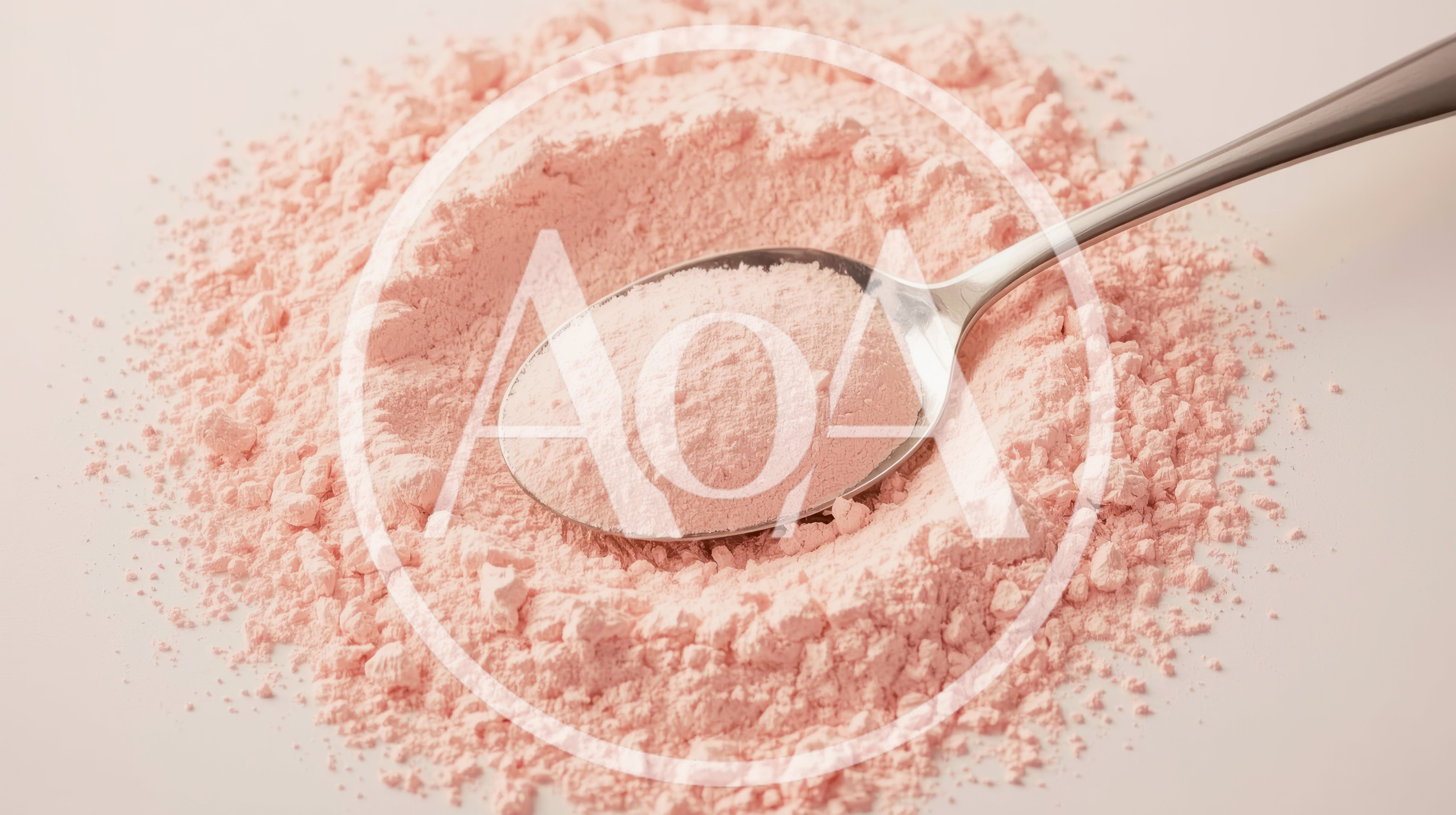 Spoonful Of Pink Powder On A Pile