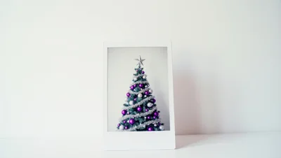 Christmas Tree With Purple And Silver Ornaments In Frame
