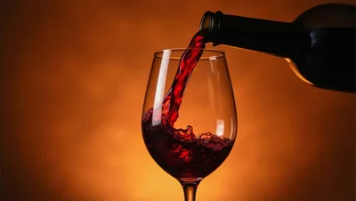 Red Wine Pouring Into A Glass