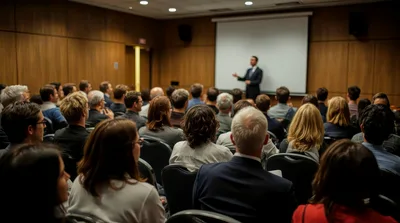 Professional Speaker Presenting To An Audience In Conference Room