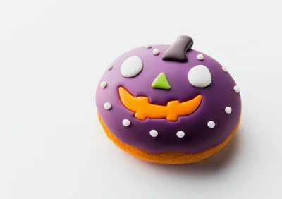 Purple Halloween Pumpkin Donut on White Background