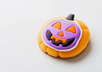 Halloween Pumpkin Cookie With Purple Icing