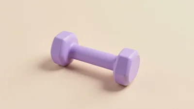 Single Purple Dumbbell On A Soft Beige Background