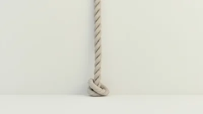 Thick Twisted Rope Hanging With A Knot
