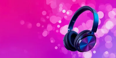 Modern Wireless Headphones Against A Vibrant Pink Bokeh Background