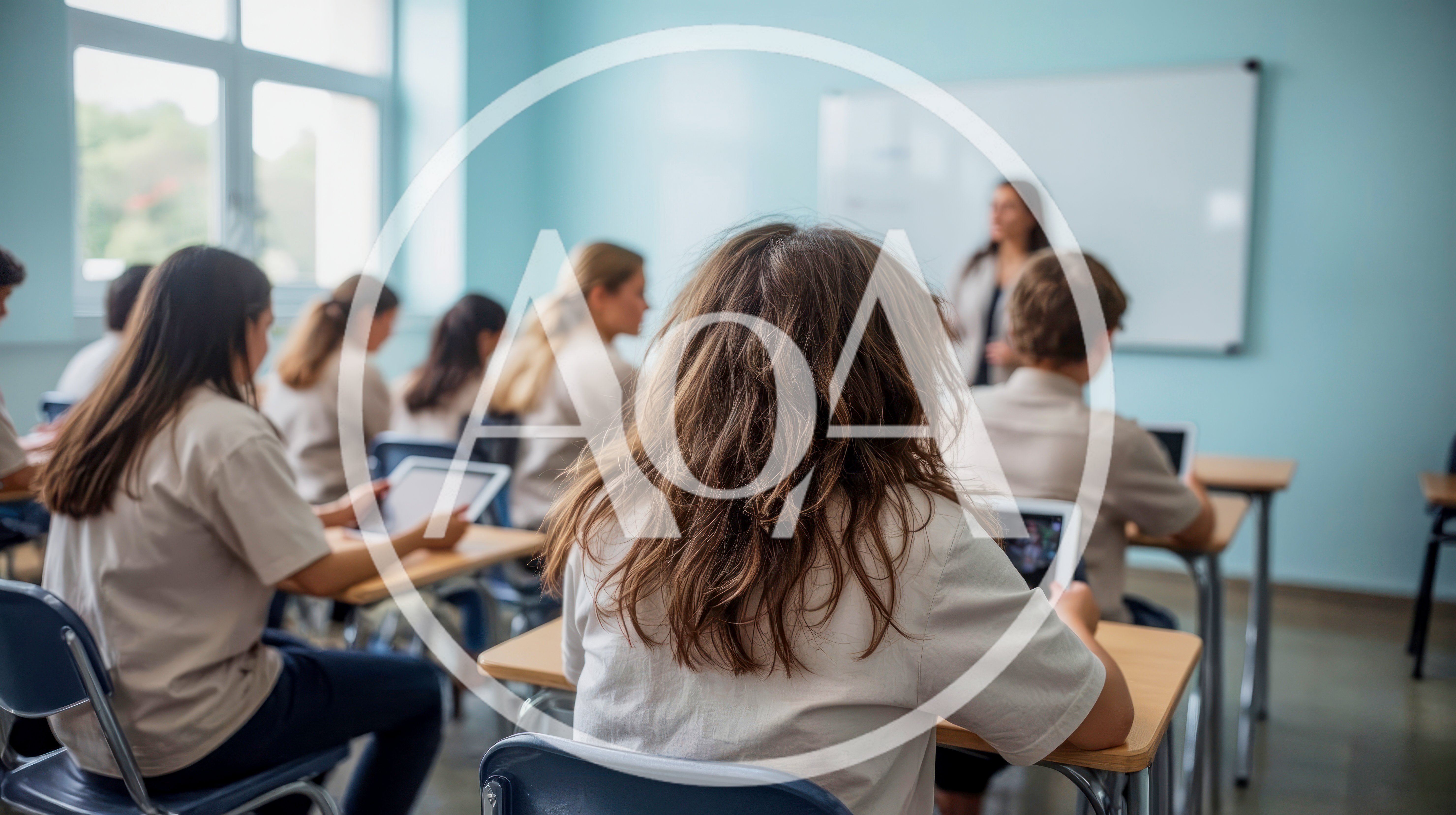 Students Using Digital Tablets In A Classroom Setting