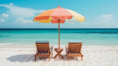 Two Wooden Beach Chairs Under A Colorful Umbrella
