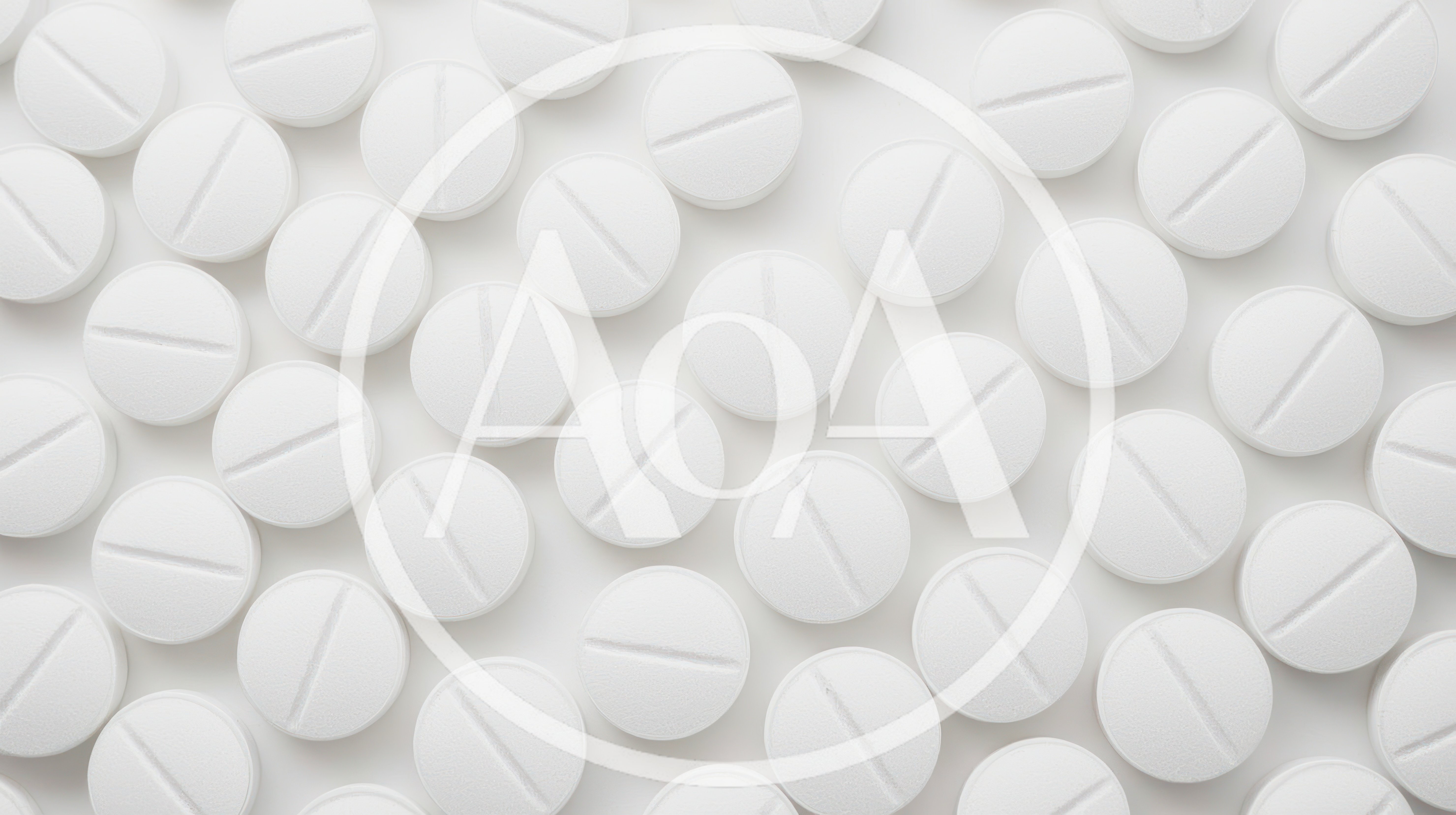 Top View Of White Round Pills On White Background