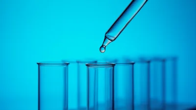 Dropper Dispensing Liquid Into A Laboratory Test Tube