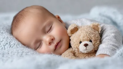 Sleeping Baby Cuddling A Small Teddy Bear