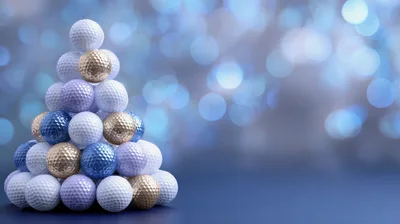 Golf Ball Christmas Tree Ornament on Blue Bokeh Background