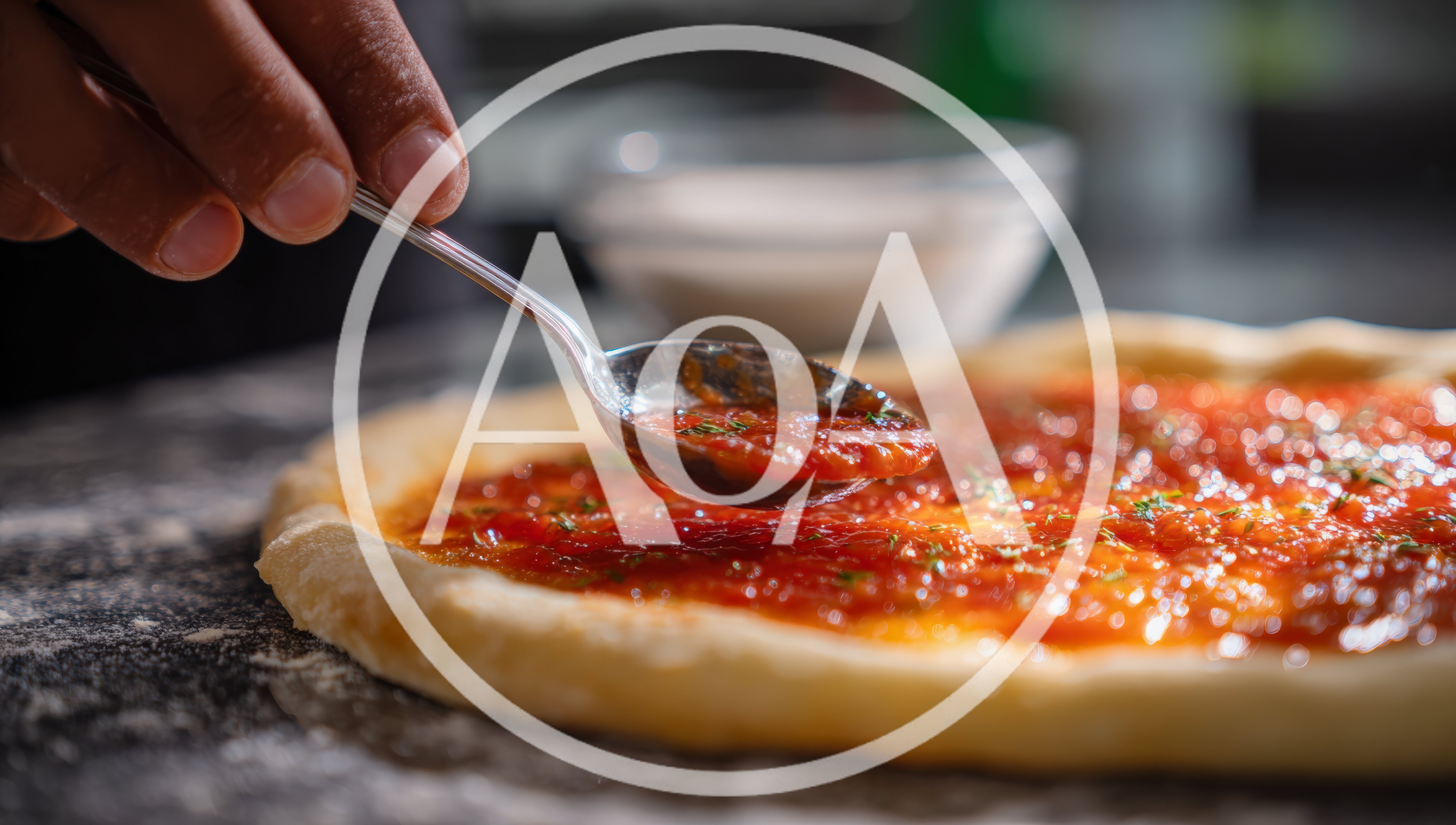 Chef Spreading Tomato Sauce On Pizza Dough